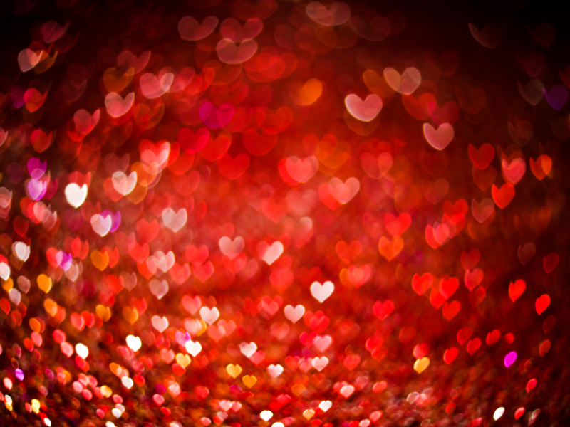 Baggrund med lysende hjerter.