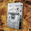 Bogen Threshing Day ses på en baggrund af ild.